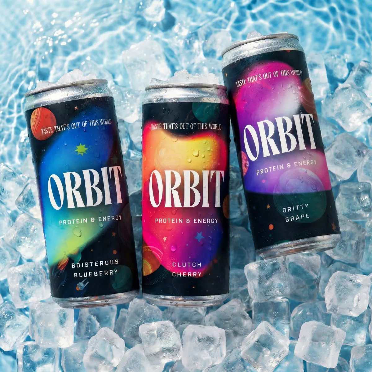 Three Orbit protein and energy drink cans on ice